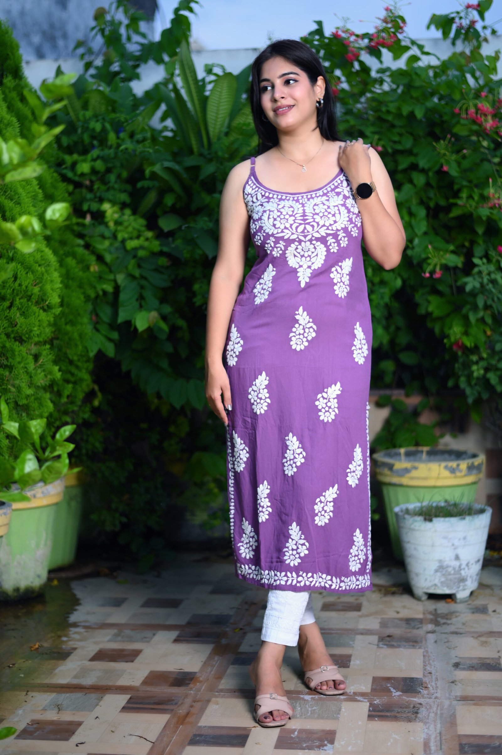"Flowy sleeveless gown made from soft modal fabric, featuring a minimalist design and elegant drape, ideal for casual or semi-formal occasions."
